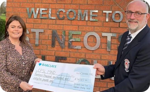 A lady and man holding a cheque