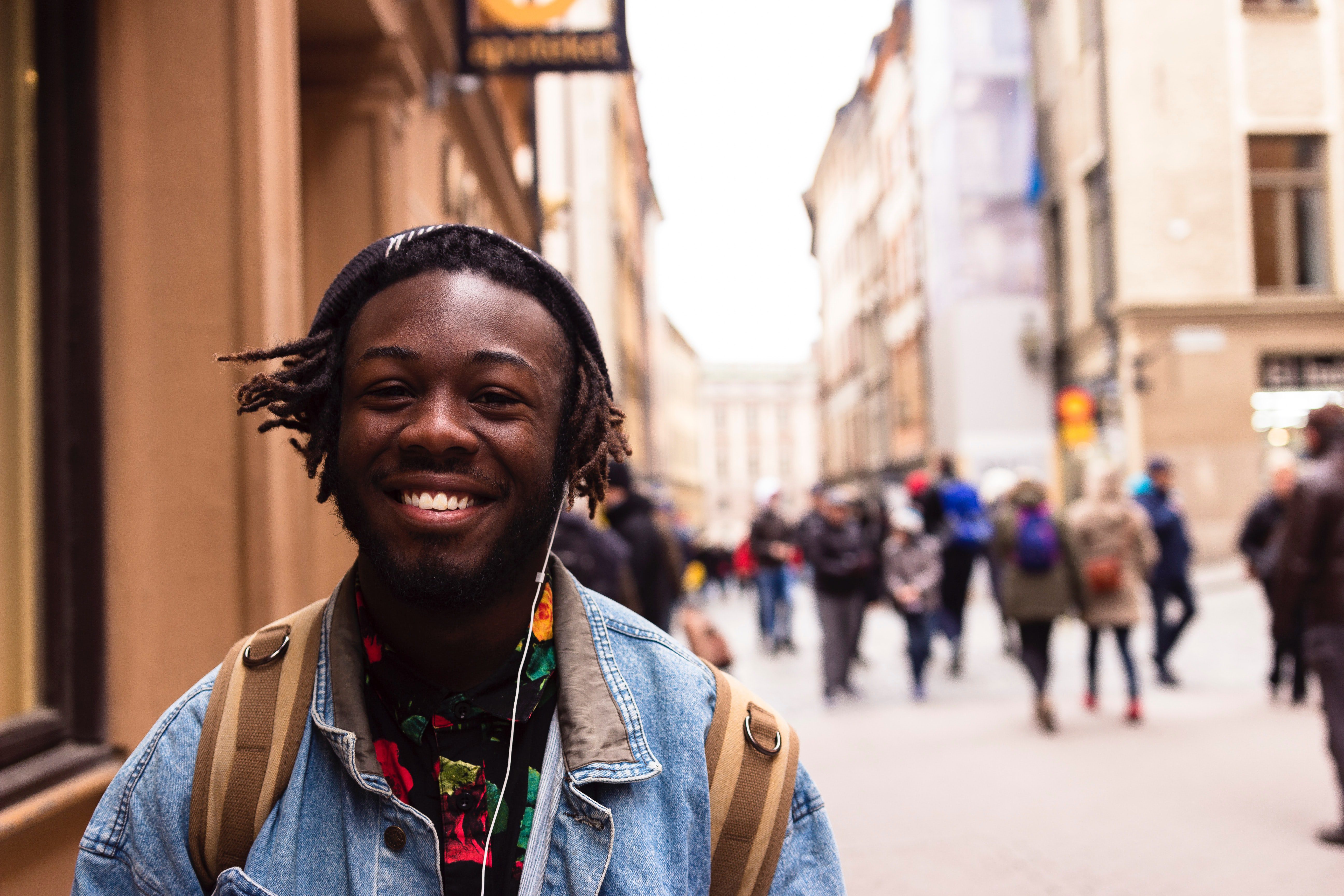 Black man smiling standing on the street
