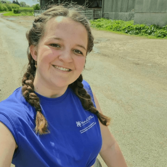 Girl with plaited pigtails talking a selfie in a blue CPSL Mind tshirt