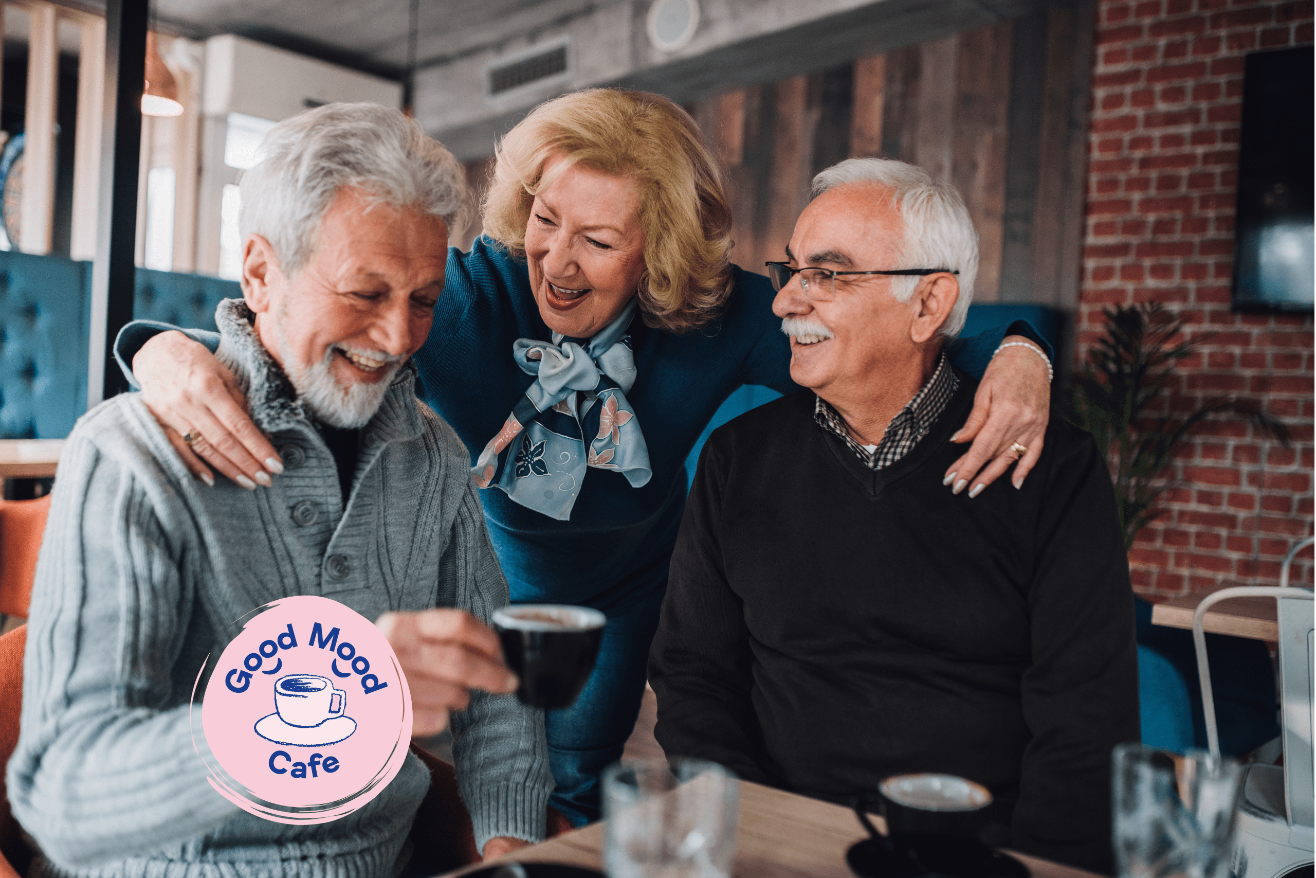 A senior woman laughing with her arms around two senior men