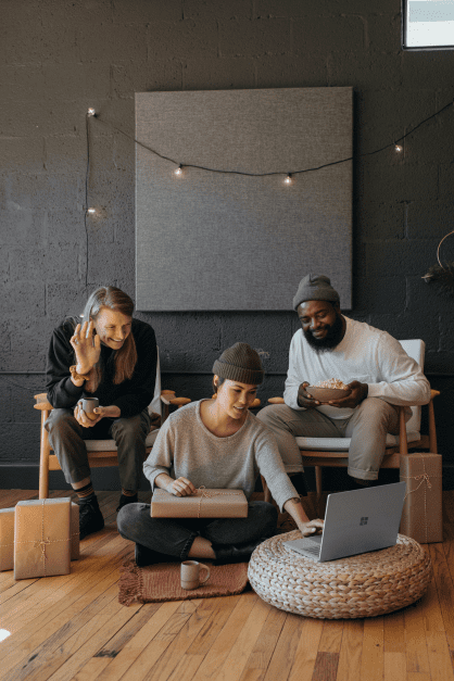 Three people working in urban, cool office space