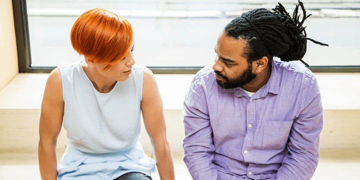 A man and a woman talking