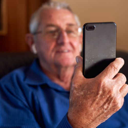 A senior man talking on the phone
