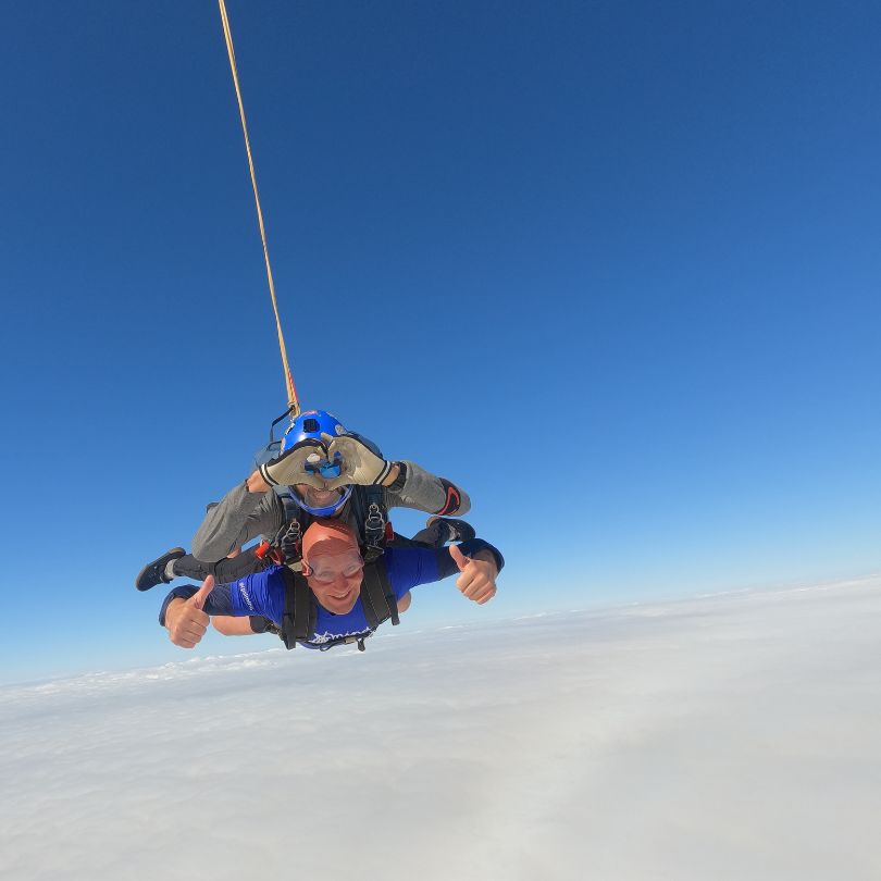 A man skydiving with an instructor for CPSL Mind