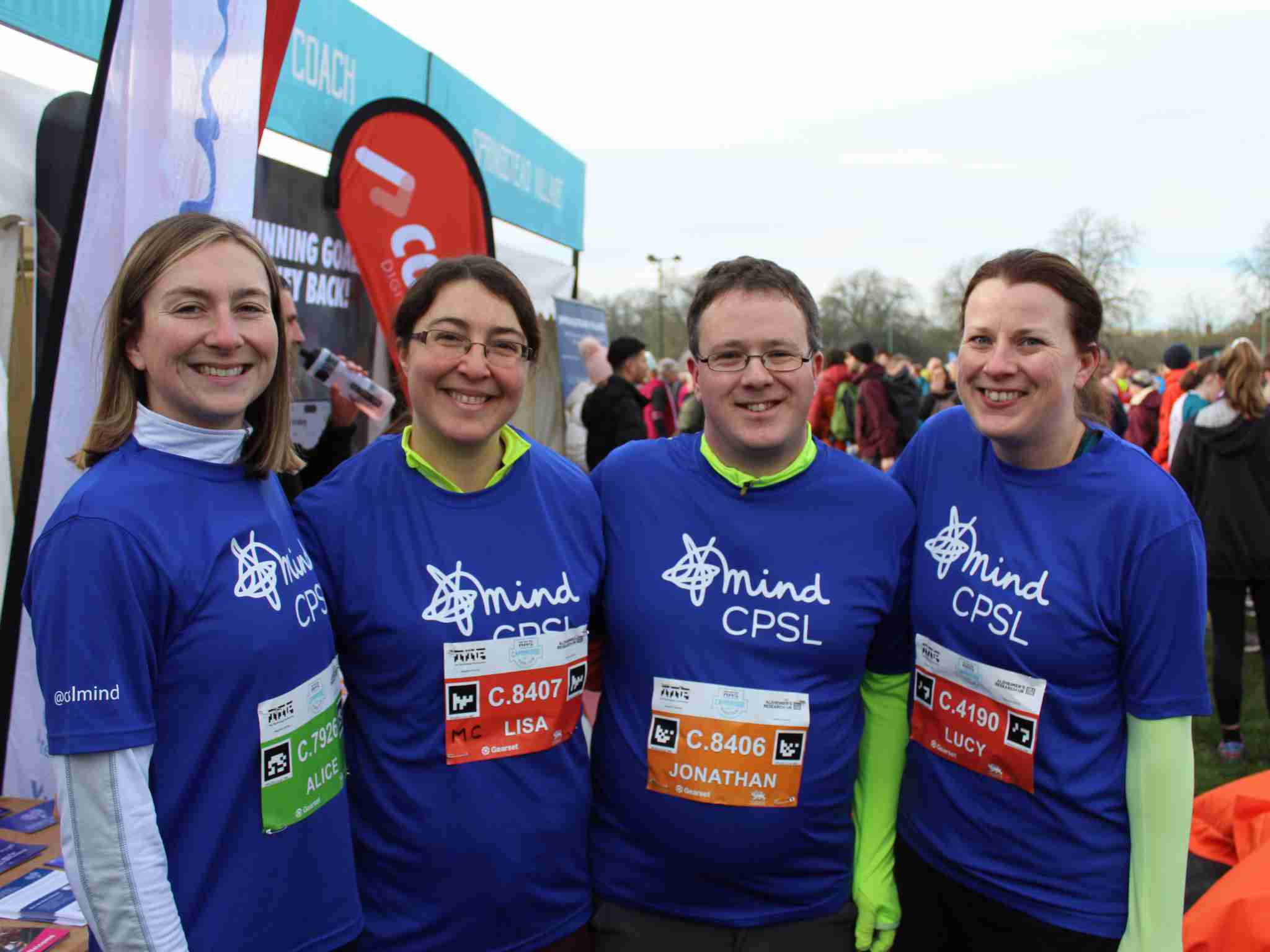 Picture of four people wearing blue CPSL Mind t-shirts and smiling at the camera - Great Eastern Run 2024
