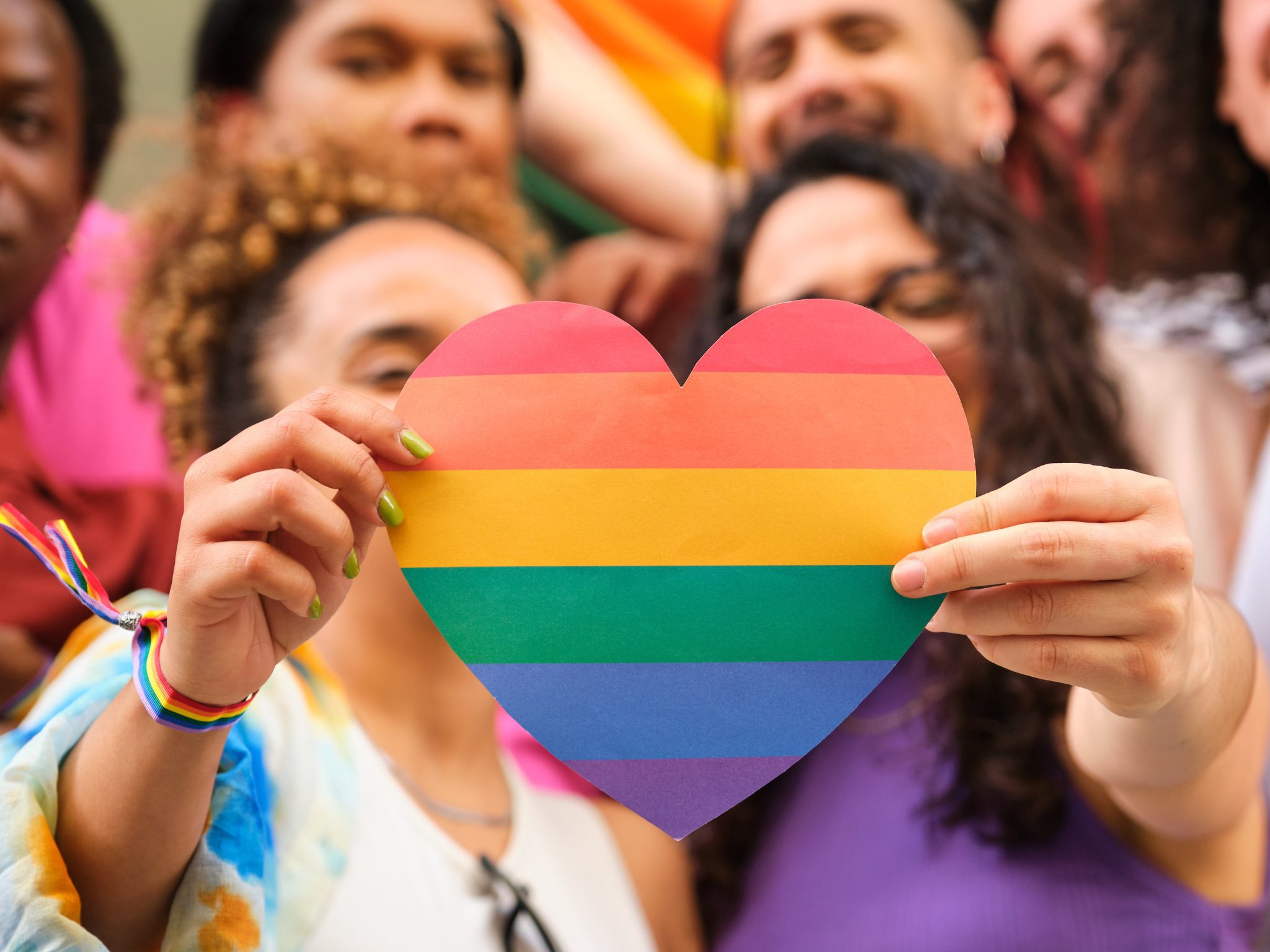 CPSL Mind's dedicated mental health LGBTQIA+ training 1 Two women holding PRIDE heart
