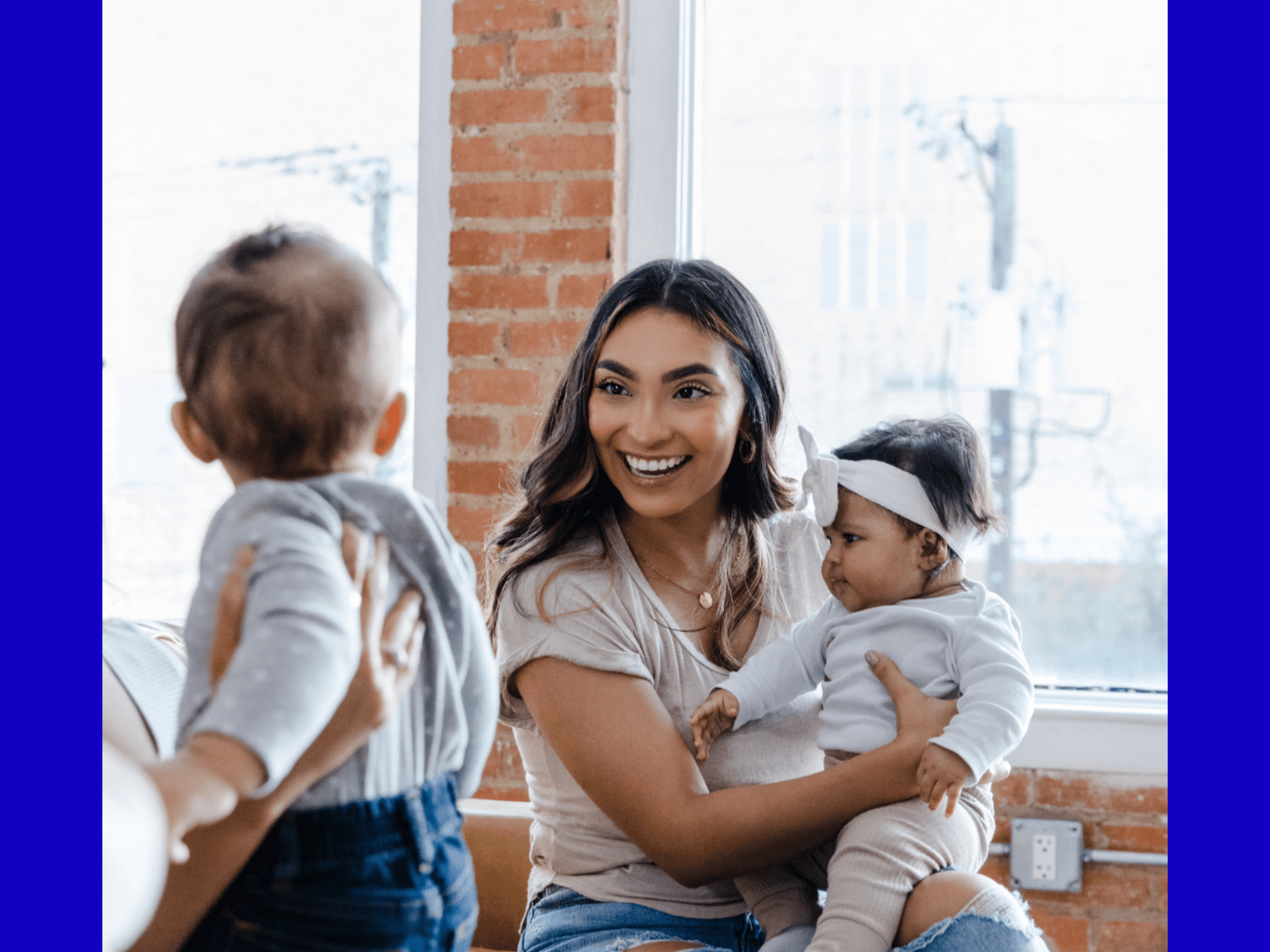 Mum holding two children