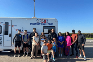 group of people in front of motor home
