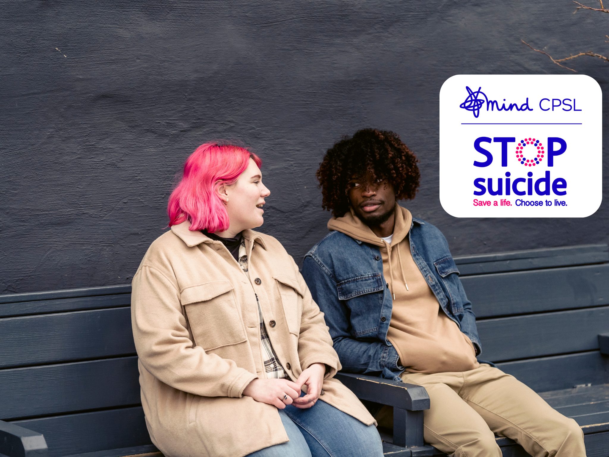 CPSL Mind announces STOP Suicide campaign rebrand 1 lady with pink hair and man sitting on bench